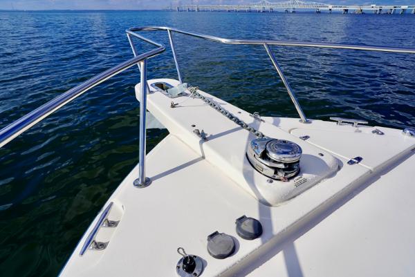 Slide: The Image of 2016 Grady-White Express 330 boat deck with anchor, railing, and ocean view. - 12