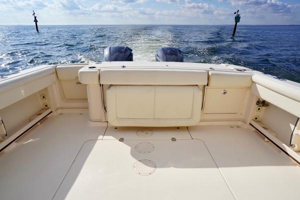 Slide: The Image of 2016 Grady-White Express 330 boat deck with ocean view and twin engines. - 19