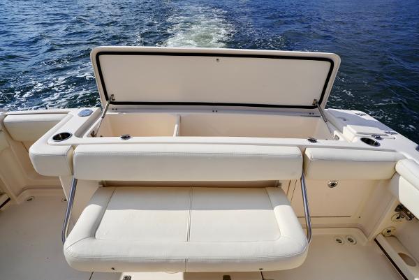 Slide: The Image of 2016 Grady-White Express 330 boat with open storage compartment on deck. - 28