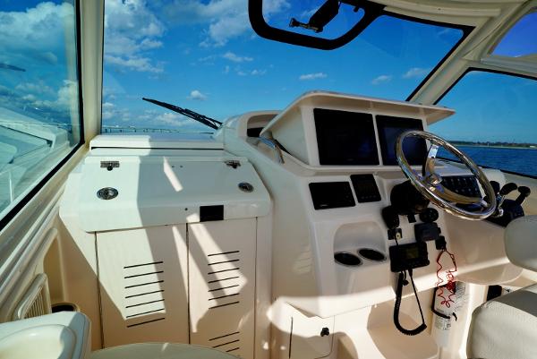 Slide: The Image of 2016 Grady-White Express 330 helm with ocean view and clear blue sky. - 32