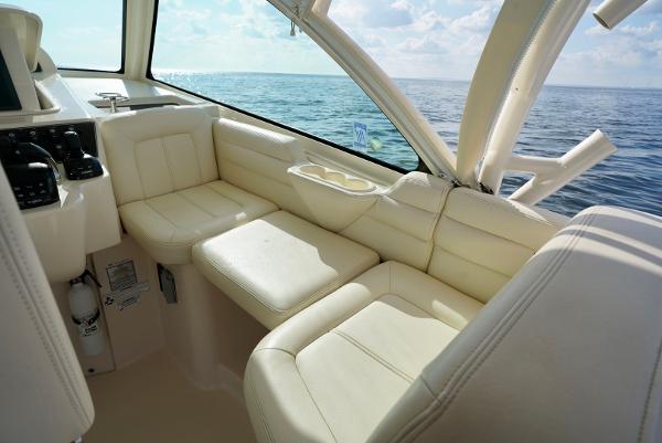 Slide: The Image of 2016 Grady-White Express 330 boat interior with cream leather seating, ocean view. - 37