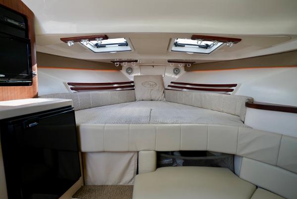 Slide: The Image of 2016 Grady-White Express 330 cabin interior with cozy bed and modern amenities. - 41