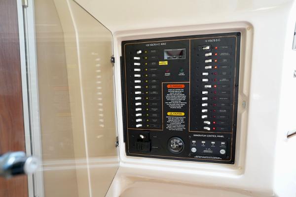 Slide: The Image of Electrical control panel on a 2016 Grady-White Express 330 boat. - 43