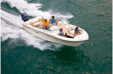Slide: The Image of 2016 Grady-White Freedom 225 boat cruising on open water. - 12