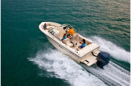 Slide: The Image of 2016 Grady-White Freedom 225 boat cruising on open water. - 13