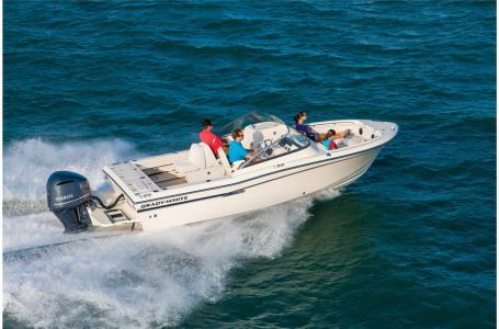 Slide: The Image of 2016 Grady-White Freedom 225 boat cruising on open water. - 15