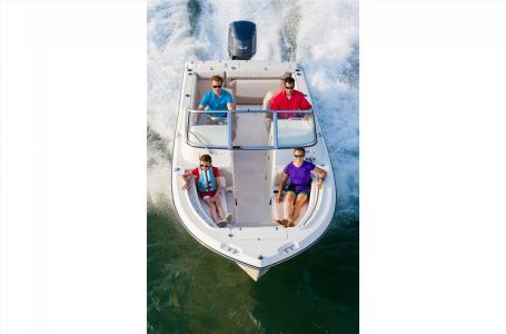 Slide: The Image of 2016 Grady-White Freedom 225 boat with passengers cruising on water. - 17