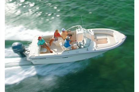 Slide: The Image of 2016 Grady-White Freedom 225 boat cruising on water with passengers. - 3