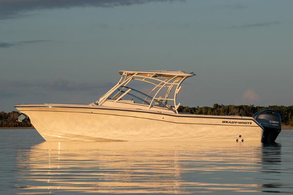 Slide: The Image of Manufacturer Provided Image: 2023 Grady-White Freedom 275 boat on calm water at sunset. - 5