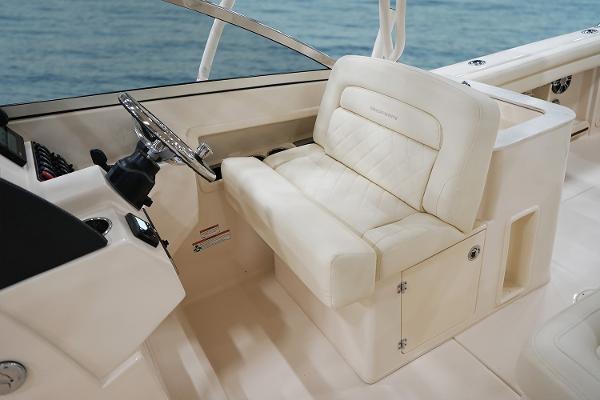 Slide: The Image of Manufacturer Provided Image: 2023 Grady-White Freedom 275 boat interior with helm seat and steering wheel. - 8
