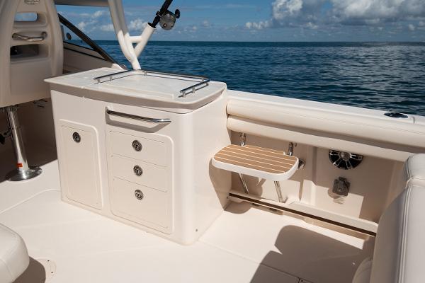 Slide: The Image of Manufacturer Provided Image: 2023 Grady-White Freedom 275 boat interior with storage and seating. - 9