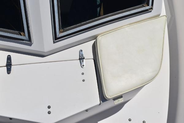 Slide: The Image of 1987 Grady-White Offshore 24 boat deck with white cushion and hatch. - 41