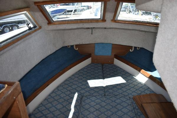 Slide: The Image of Interior cabin of a 1987 Grady-White Offshore 24 boat with blue and white upholstery. - 47
