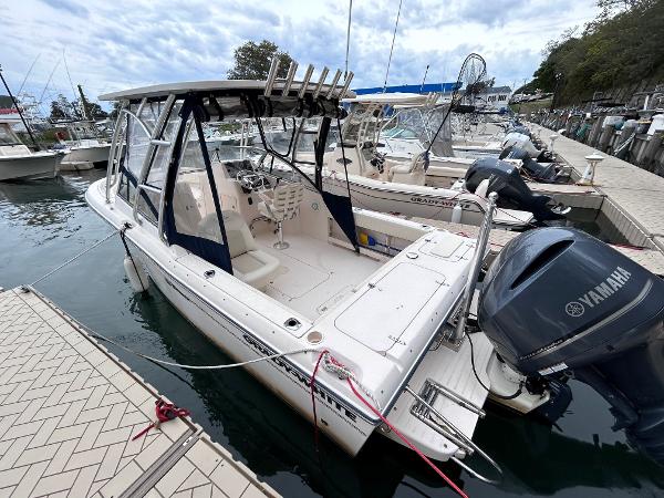 Slide: The Image of 2009 Grady-White Tournament 225 boat docked with Yamaha outboard motor. - 0