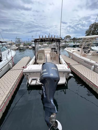 Slide: The Image of 2009 Grady-White Tournament 225 boat docked with Yamaha 250 engine. - 2