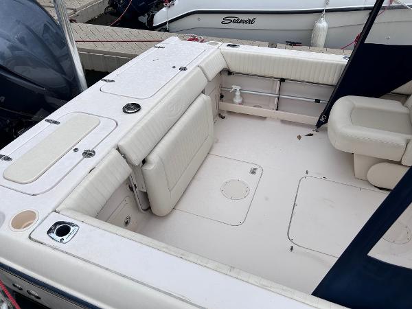 Slide: The Image of 2009 Grady-White Tournament 225 boat interior with seating and storage compartments. - 3
