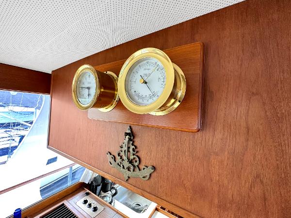 Slide: The Image of Brass gauges on 1980 Grand Banks 42 Europa yacht interior with wood paneling. - 34