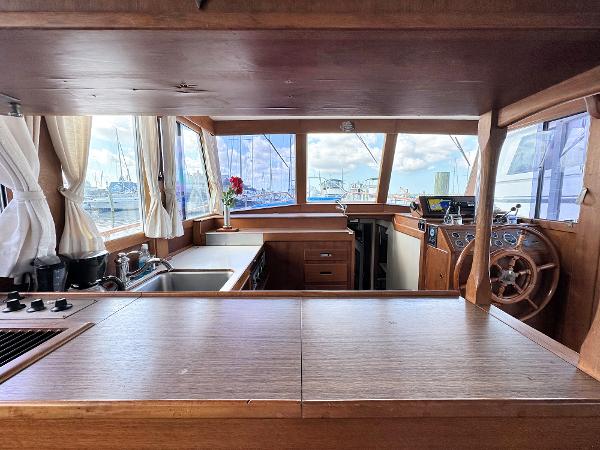 Slide: The Image of Interior of 1980 Grand Banks 42 Europa yacht with wooden cabinetry and helm. - 36
