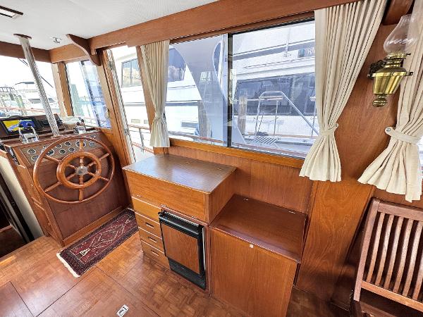 Slide: The Image of Interior of 1980 Grand Banks 42 Europa yacht with wooden helm and cabinetry. - 37