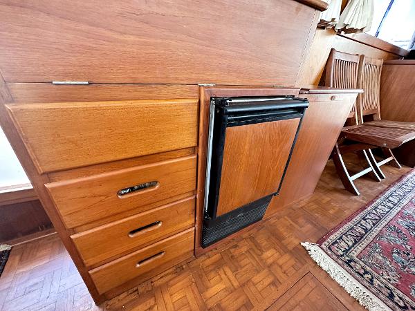 Slide: The Image of Wooden interior of 1980 Grand Banks 42 Europa yacht with drawers and mini fridge. - 38