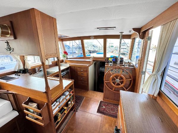 Slide: The Image of Interior of 1980 Grand Banks 42 Europa yacht with wooden helm and cabinetry. - 39