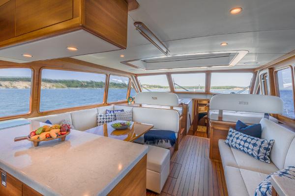 Slide: The Image of Luxurious interior of 2023 Eastbay EB60 yacht with elegant seating and scenic views. - 1