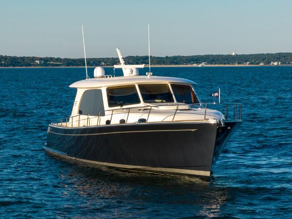 Slide: The Image of 2023 Eastbay EB60 yacht cruising on open water. - 11