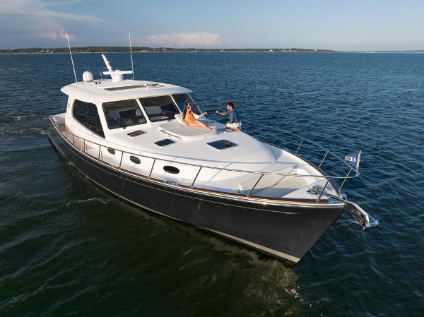 Slide: The Image of Luxurious 2023 Eastbay EB60 yacht cruising on open water. - 13