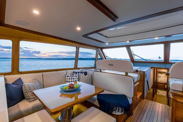 Slide: The Image of Luxurious 2023 Eastbay EB60 yacht interior with elegant seating and ocean view. - 20