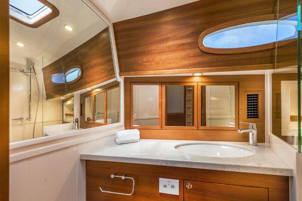 Slide: The Image of Luxurious 2023 Eastbay EB60 yacht bathroom with wood accents and modern fixtures. - 25