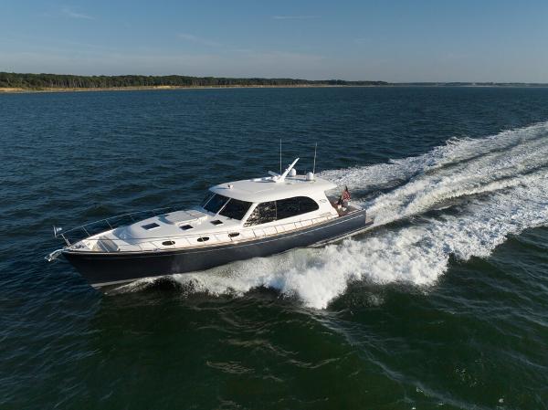 Slide: The Image of 2023 Eastbay EB60 yacht cruising on open water. - 29
