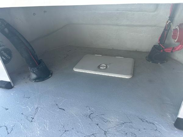 Slide: The Image of 2024 Gulf Coast VariSide boat storage compartment with wiring and access panel. - 18