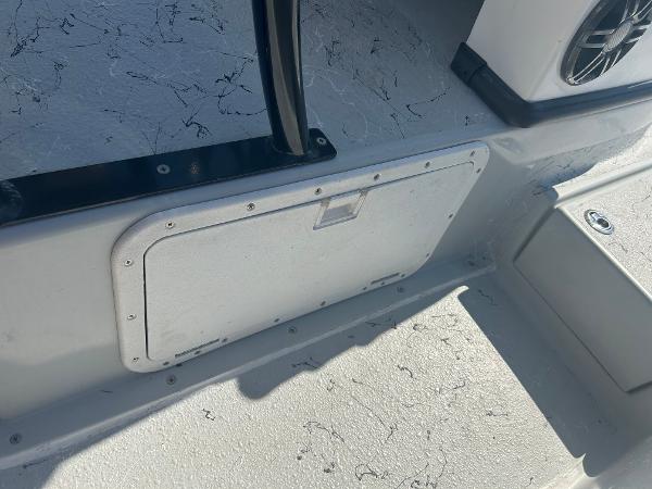 Slide: The Image of 2024 Gulf Coast VariSide boat interior storage compartment and speaker. - 19