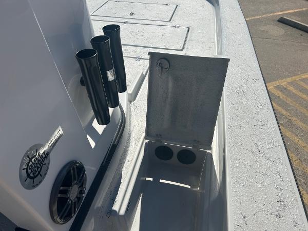 Slide: The Image of 2024 Gulf Coast VariSide boat deck with rod holders and storage compartment. - 2