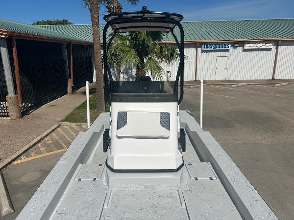 Slide: The Image of 2024 Gulf Coast VariSide boat with center console in a marina. - 21