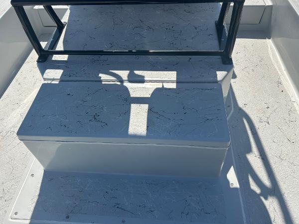 Slide: The Image of 2024 Gulf Coast VariSide boat deck with textured surface and railing. - 29