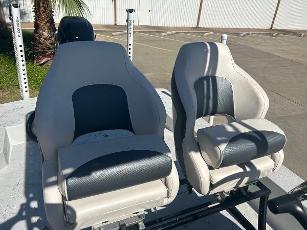 Slide: The Image of 2024 Gulf Coast VariSide boat seats in a parking lot. - 5