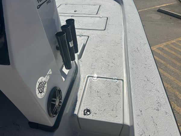 Slide: The Image of 2024 Gulf Coast VariSide boat deck with rod holders and storage compartments. - 6