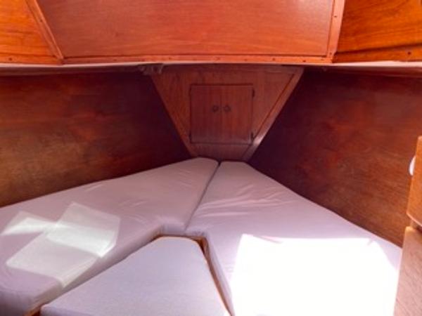 Slide: The Image of 1978 Gulfstar 50 sailboat cabin with V-berth and wooden interior. - 13