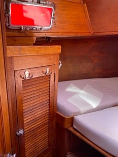Slide: The Image of 1978 Gulfstar 50 yacht interior with wooden cabinetry and bed - 14