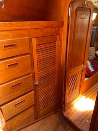 Slide: The Image of 1978 Gulfstar 50 yacht interior with wooden cabinets and door. - 15