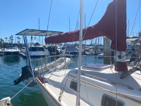 Slide: The Image of 1978 Gulfstar 50 sailboat docked in a marina with other boats. - 2