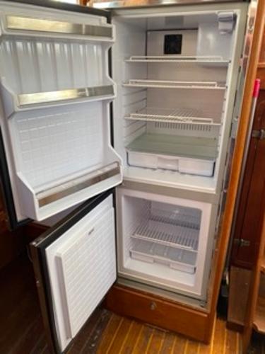 Slide: The Image of Open refrigerator and freezer in a 1978 Gulfstar 50 yacht. - 27