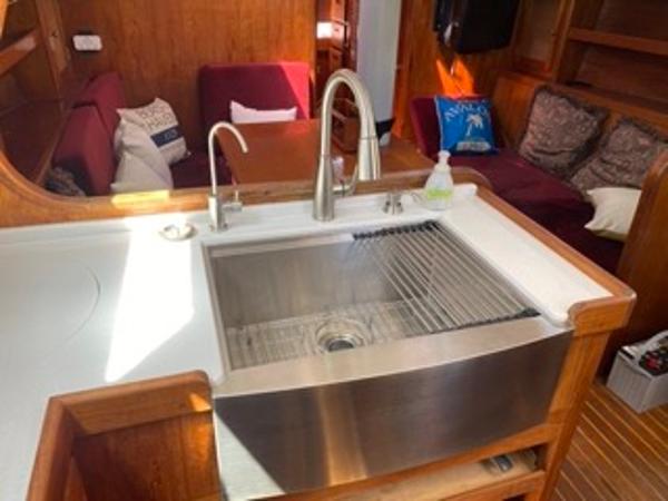 Slide: The Image of 1978 Gulfstar 50 yacht interior with stainless steel sink and cozy seating area. - 28