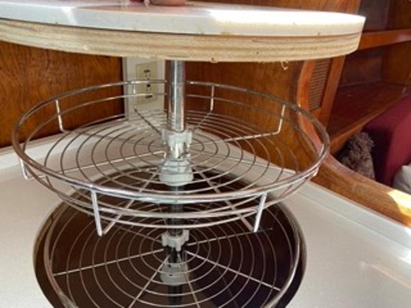 Slide: The Image of 1978 Gulfstar 50 yacht interior with a rotating wire shelf in the kitchen. - 29