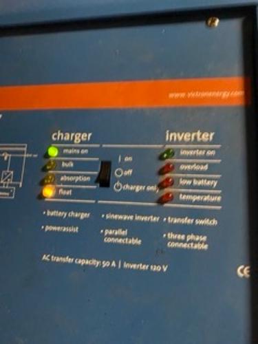 Slide: The Image of 1978 Gulfstar 50 yacht electrical panel with charger and inverter indicators. - 41