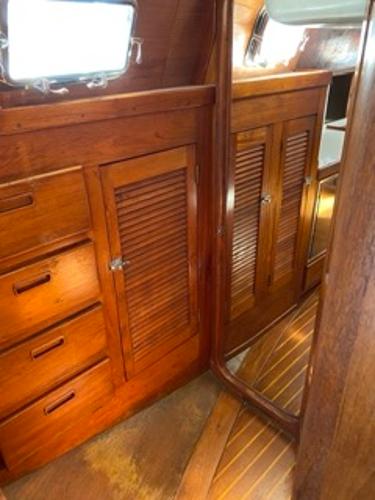 Slide: The Image of 1978 Gulfstar 50 yacht interior with wooden cabinets and drawers. - 44