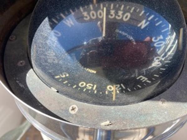 Slide: The Image of Close-up of a compass on a 1978 Gulfstar 50 sailboat. - 46