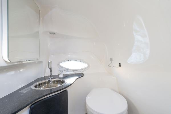 Slide: The Image of Modern bathroom in Hanover 305, 2025 model, featuring sleek sink and compact toilet design. - 11