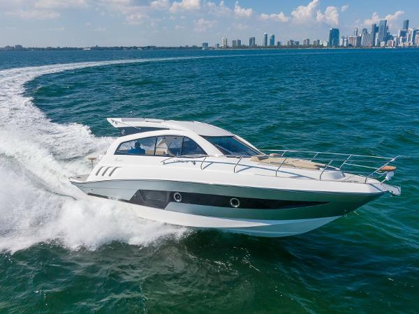 Slide: The Image of Luxury Hanover 375 yacht cruising on open water, 2025 model. - 1